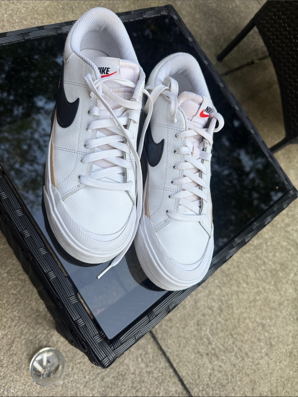 Nike White Sneakers with Black Swoosh and Small Red Logo